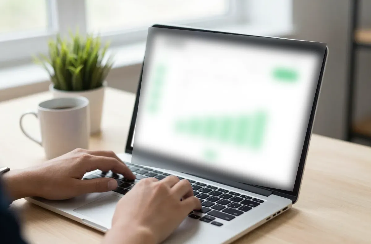 Small business owner working on a laptop with a well-maintained website
